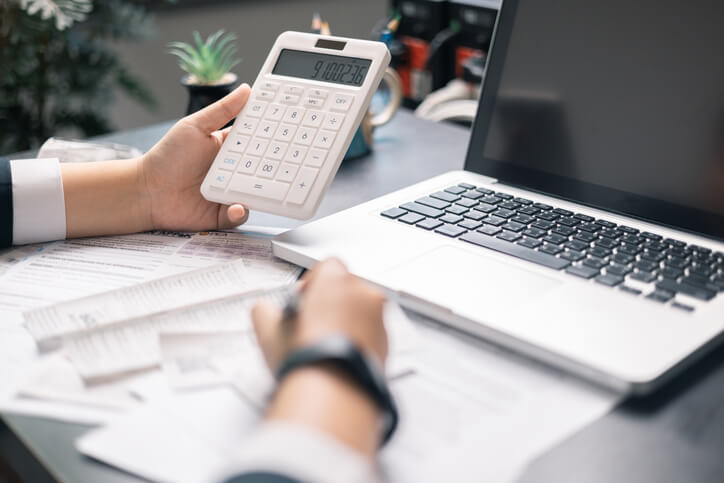 An accounting administrator reviewing financial reports